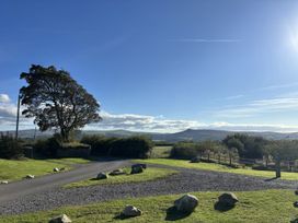 A landscape with trees and mountains at Bwthyn Bach Newport