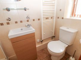 A bathroom with a sink and toilet at Bwthyn Trecoed St. Clears near Carmarthen