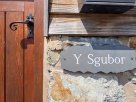 A door with a sign that says Y Sgubor at Ysgubor Pwlliago, Pennant Valley near Llangynog