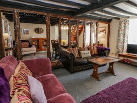 A living room with a sofa and coffee table at Penlone Cottage Rhayader