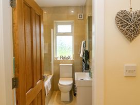 A bathroom with a toilet and sink at Rowantree in Beaufort, County Kerry