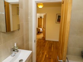 A bathroom with a sink and mirror at Rowantree, Beaufort, County Kerry