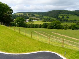 A view of hills and fields with a fence at Tyn Y Celyn Canol Clocaenog near Ruthin