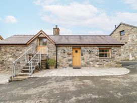 A stone house with steps and wooden door at Briws and 963354 together they sleep 35