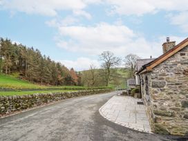 An outdoor scene with a road and stone wall at Briws and 963354 together they sleep 35