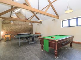 A games room with a pool table ping pong table and foosball table at Keepers Cottage in Winterborne Stickland