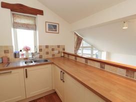 A kitchen with a sink and countertop at Hawkrigg Cottage in Kirkby Lonsdale