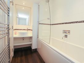 A bathroom featuring a bathtub and sink at Hawkrigg Cottage in Kirkby Lonsdale