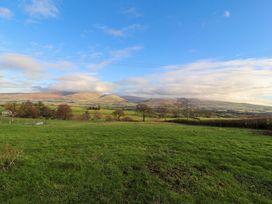 A scenic view of mountains and grassland at Hawkrigg Cottage Kirkby Lonsdale
