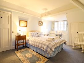 A bedroom with a bed and bedside table at Murmur Y Don in Harlech