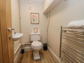 A bathroom with a toilet and sink at Jubilee in Graythwaite near Hawkshead