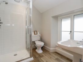 A bathroom with a shower, toilet, and sink at Jubilee in Graythwaite near Hawkshead