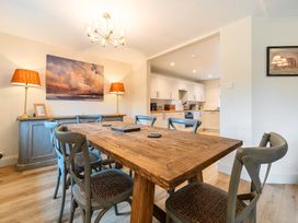 A dining room with a table and chairs at Jubilee at the Graythwaite Estate in Graythwaite near Hawkshead