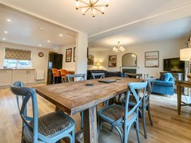 A dining room with a table and chairs at Jubilee at the Graythwaite Estate near Hawkshead