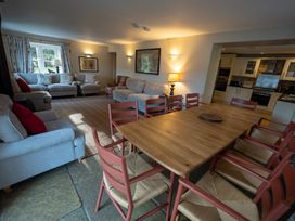 A dining room with a table and chairs at Hammerhole in Graythwaite near Hawkshead