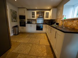 A kitchen with appliances and countertops at Hammerhole Graythwaite near Hawkshead