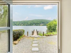 A view of a dock leading to water at Hammerhole at the Graythwaite Estate near Hawkshead