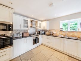 A kitchen with appliances and countertops at Hammerhole at the Graythwaite Estate near Hawkshead
