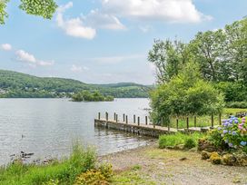 A dock extending into the water at Hammerhole at the Graythwaite Estate near Hawkshead