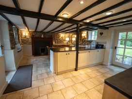 A kitchen with cabinets and a counter at Hullet Hall in Graythwaite near Hawkshead