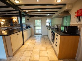 A kitchen with appliances and counters at Hullet Hall in Graythwaite near Hawkshead