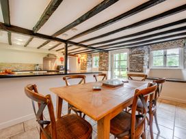 A dining room with a table and chairs at Hullet Hall at the Graythwaite Estate near Hawkshead