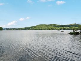 A view of water with hills and boats at Hullet Hall at the Graythwaite Estate near Hawkshead