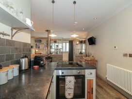 A kitchen with a stove and sink at The Stable in Deepdean near Ross-on-Wye