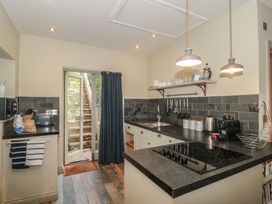 A kitchen with a stove and sink at The Stable in Deepdean near Ross-on-Wye