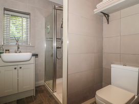 A bathroom with a sink, shower, and toilet at The Stable in Deepdean near Ross-on-Wye