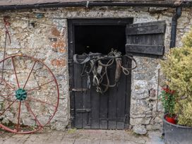 A barn door with harness and wagon wheel at Mrs Delaney's Loft Ardfinnan near Clonmel County Tipperary