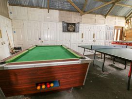 A games room with a pool table and a table tennis table at Cariad Cottage in Cross Inn