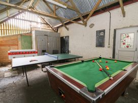 A game room with a pool table and table tennis table at Cariad Cottage in Cross Inn
