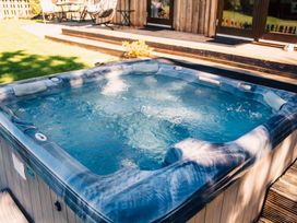A hot tub in an outdoor area at Sycamore Lodge Nantmel near Rhayader