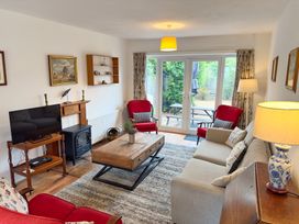 A living room with a coffee table and television at 38 Dale End Brancaster Staithe near Burnham Market