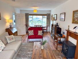 A living room with a sofa and coffee table at 38 Dale End Brancaster Staithe near Burnham Market