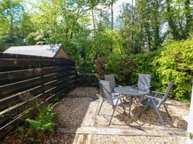 A garden with a table and chairs at No. 4 Lansdowne Village Kenmare, The Ring of Kerry, County Kerry