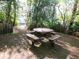 A picnic table and benches in a garden at No. 4 Lansdowne Village, Kenmare, The Ring of Kerry, County Kerry