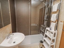 A bathroom with a shower and sink at Grey Croft in Embleton
