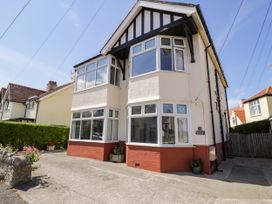 A house with bay windows and a driveway at Meadway House in Rhos-on-Sea