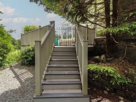 Stairs leading to a fenced area at Eden Lodge in Bardsea