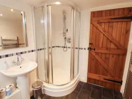 A bathroom with a shower and sink at Stable Cottage in Bolton Low Houses