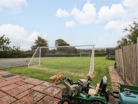 An outdoor area with a goal post and a toy tractor at Stable Cottage in Bolton Low Houses