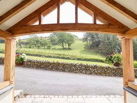 An outdoor area with a view of grass and trees at Ty Gwyn in Llangwm near Bala