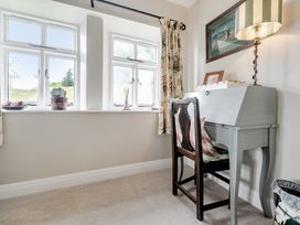 An office with a desk and chair at Dove Cottage at the Graythwaite Estate near Hawkshead