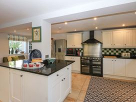 A kitchen with appliances and a countertop at Nant-yr-Rhedyn in Red Wharf Bay