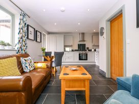 A living room with a sofa and coffee table at The Lodge, Lower Trefedw near Abergavenny
