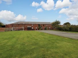 An outdoor area with a building and a goalpost at Hayloft Cottage Bolton Low Houses