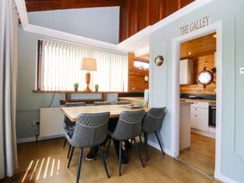 A dining area with a table and chairs at Boathouse in Deganwy near Llandudno