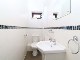 A bathroom with a toilet and sink at Boathouse in Deganwy near Llandudno